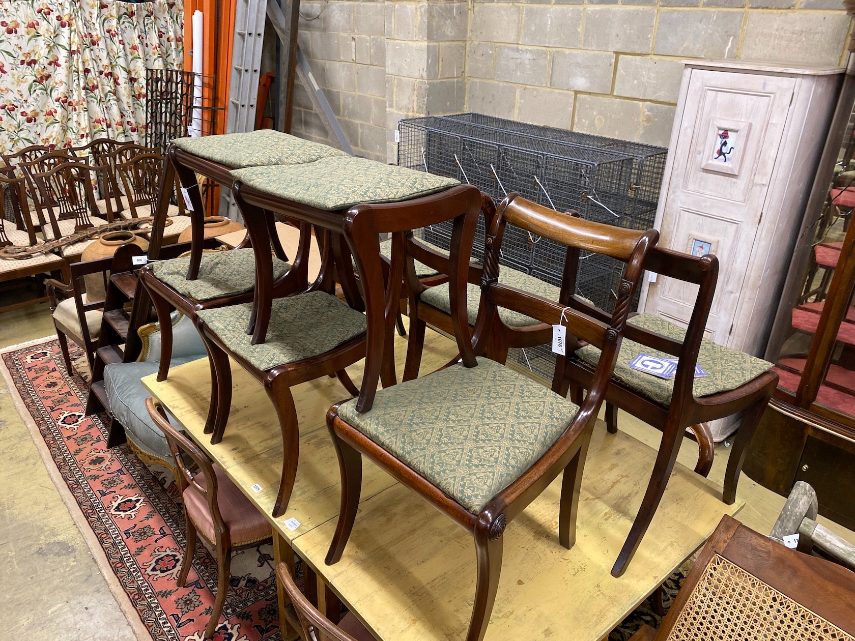 Six Regency mahogany cane and drop in seat dining chairs (four plus two) together with a pair of similar stools